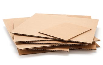 A pile of corrugated pads on a white background.