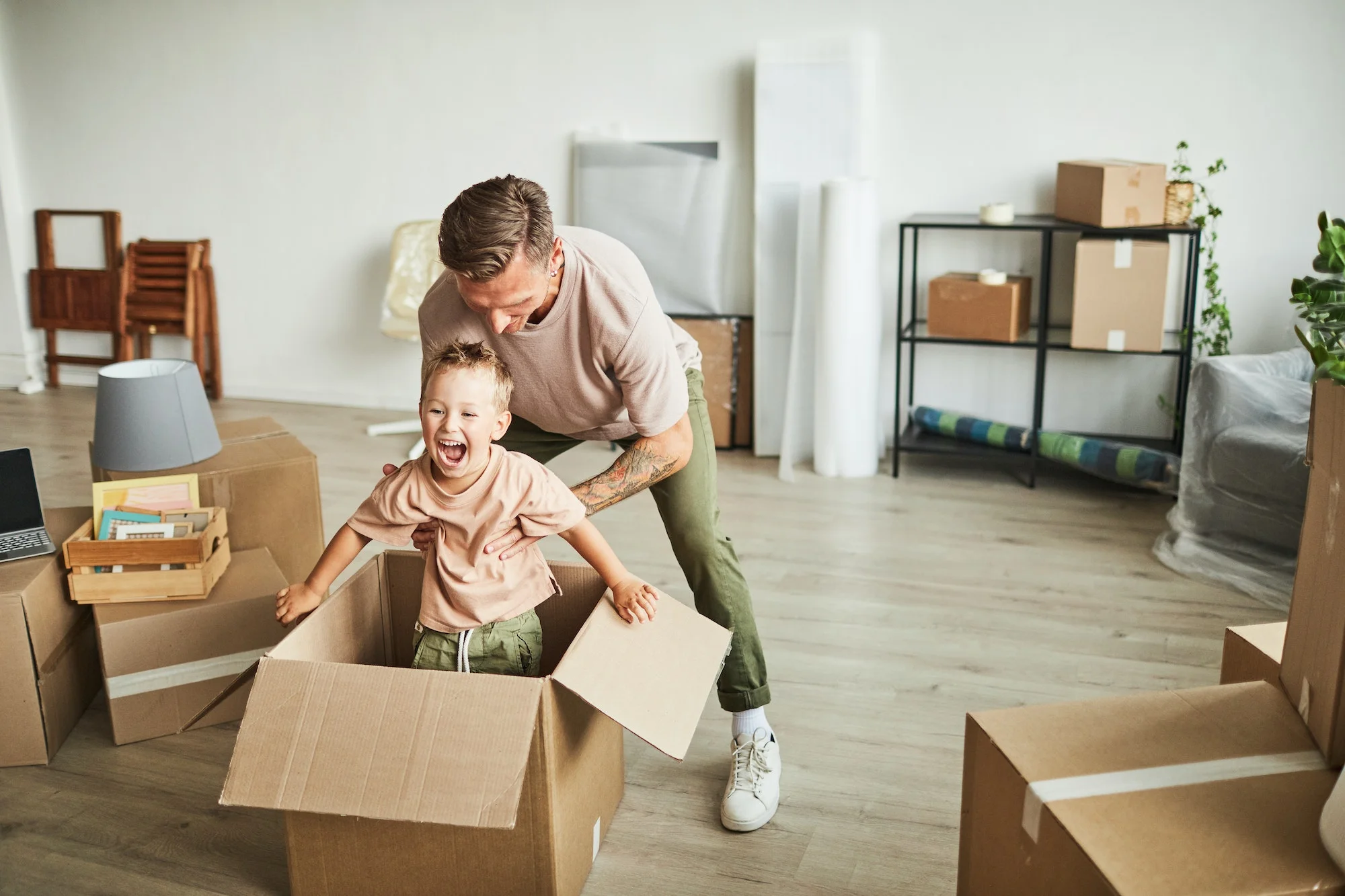 A man and his son are moving into a new home.