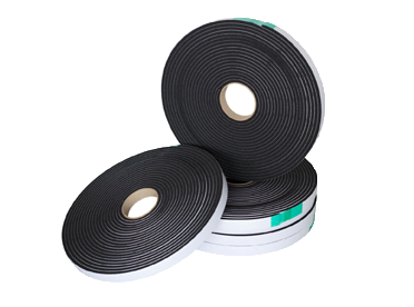 Three rolls of black foam tape on a white background used for packaging.