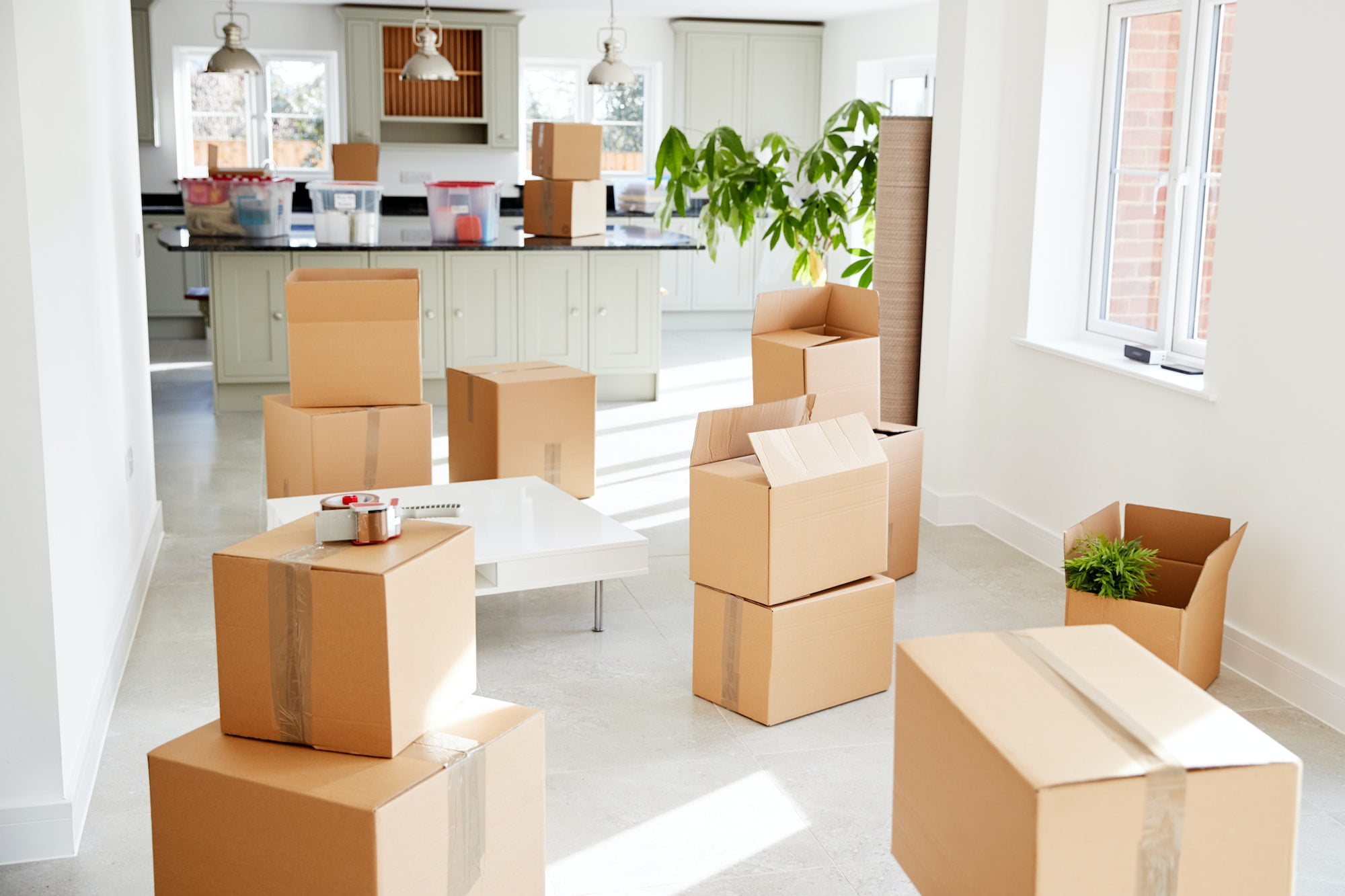 Moving boxes in a living room.